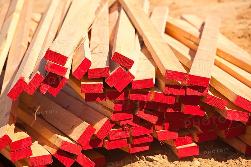 Abstract Stack of 2x4 Construction Wood with Red Painted Ends