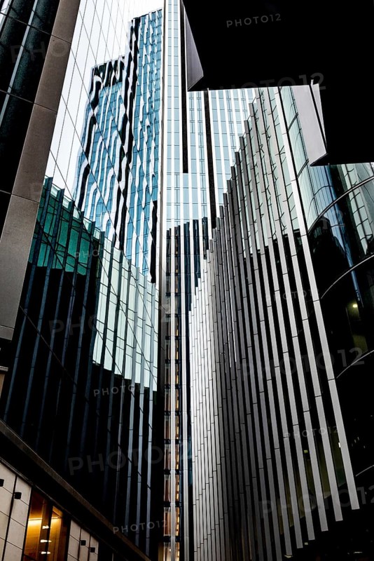 Modern abstract reflections in glass fronted office buildings in the financial district of the British capital London