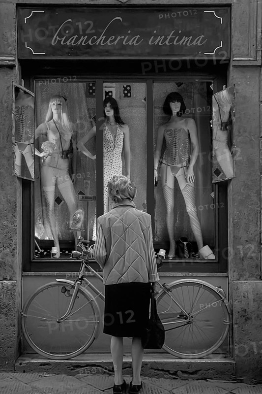 Elderly lady in front of an erotic shop window, montage, Siena, Tuscany, Italy