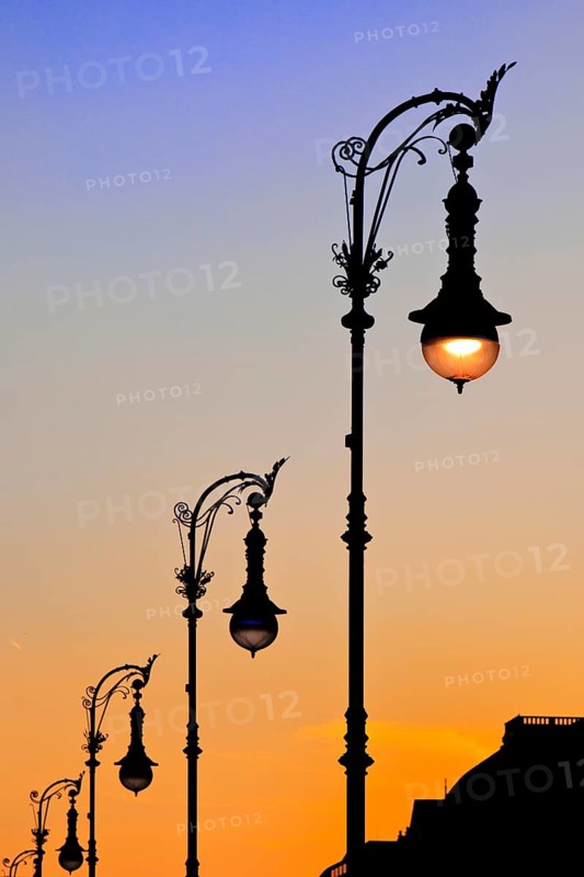 Old Berlin gas lanterns in the street Unter den Linden At sunset, Berlin, Germany