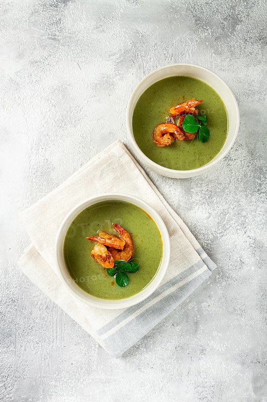 Pea cream soup, with shrimp, green soup, homemade, top view, no people