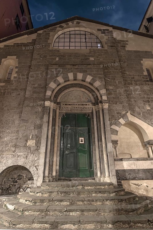 Main entrance of the Chiesa dei Santi Cosma e Damiano, Romanesque church in the historic centre, Piazza di S. Cosimo, Genoa, Italy
