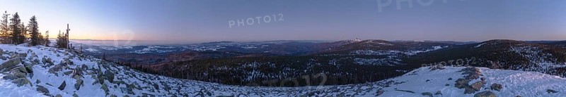 View from Mount Lusen over the hills of the bavarian forest at sunrise in winter, Bavaria, Germany