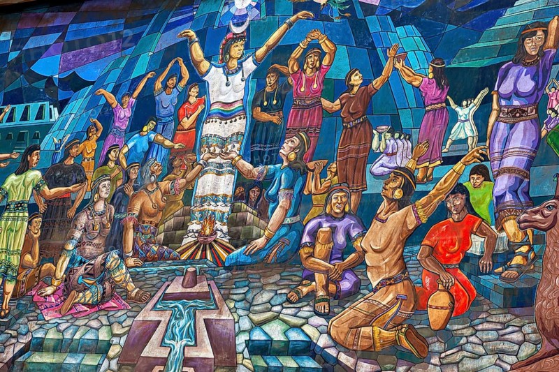 Vivid wall painting with scenes of a traditional celebration, rich in colors and moving figures, colorful image of the Incas in Ollantaytambo in the Andes of Peru