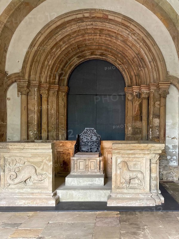 Copy of historical imperial chair from the 11th century on display in the vestibule of the former collegiate church of St Simon and Judas, Goslar, Lower Saxony, Germany