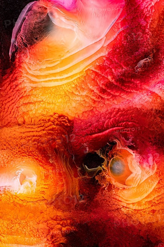 A mesmerizing abstract liquids art piece featuring vibrant red, orange, and pink hues that create galactic, swirling patterns. The interplay of colors evokes a sense of movement