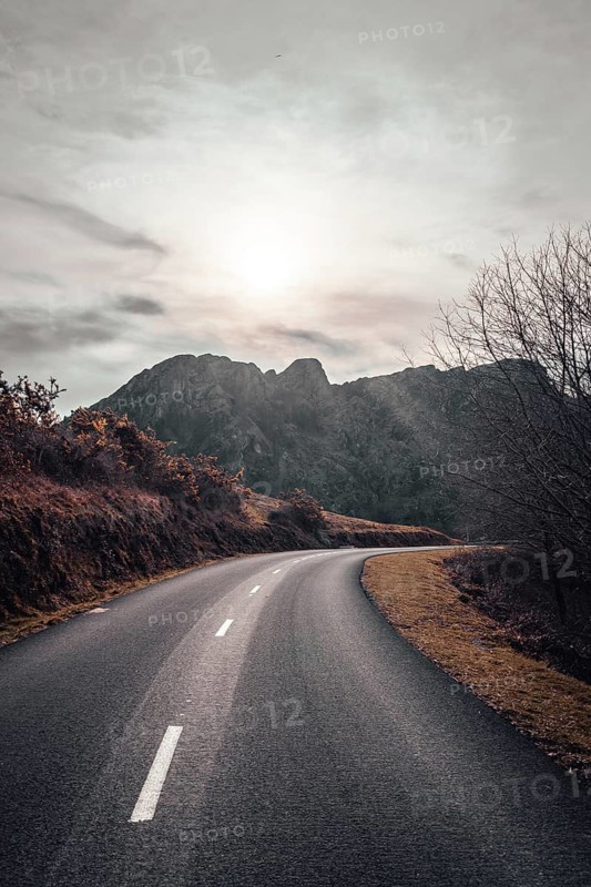 Road at sunrise in the mountain of Aiako Harria or Peñas de Aya, Guipúzcoa. Basque Country
