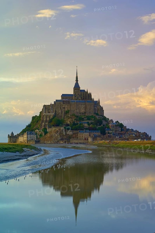 Picturesque view of Mont Saint-Michel on an island with medieval architecture at dusk, summer, Le Mont-Saint-Michel, Brittany, Normandy, France