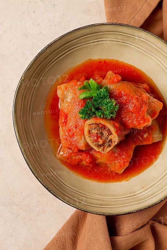 Stuffed cabbage rolls, with minced meat, in tomato sauce, on a beige background, food and drink, healthy eating, healthy lifestyle, cuisine, rustic, cabbage roll, top view, no people
