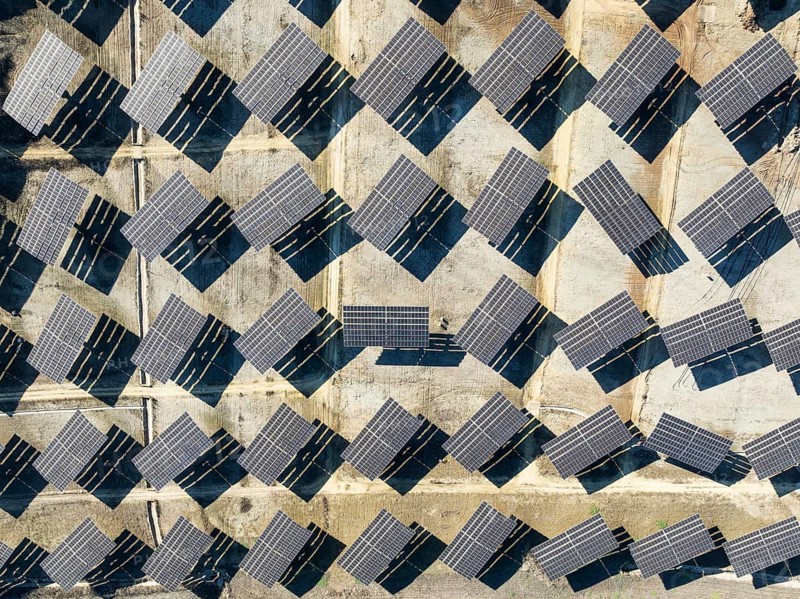 Rows of solar panels at a photovoltaic plant near Vejer de la Frontera. Aerial view. Drone shot. Cádiz province, Andalusia, Spain