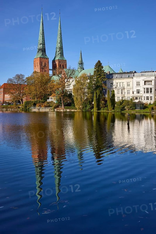 Mill pond with general buildings, Lübeck Cathedral and trees, symmetrical reflections on the water surface, Hanseatic city of Lübeck, Schleswig-Holstein, Germany