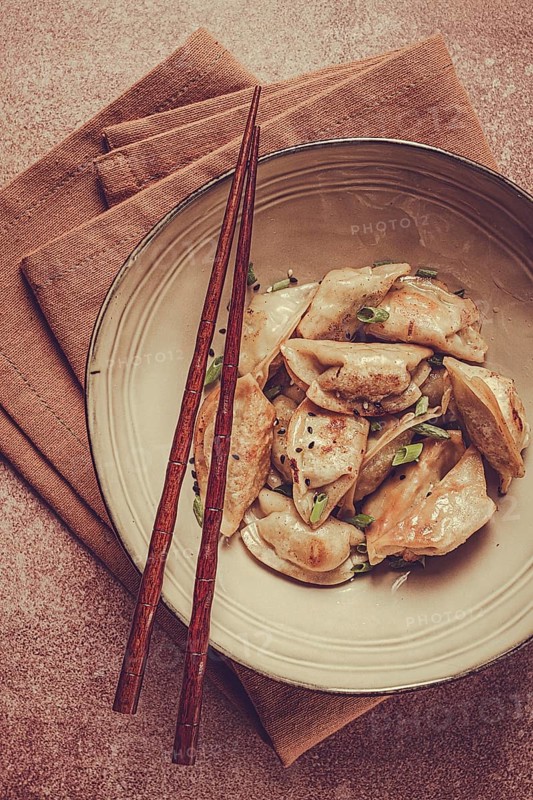 Japanese fried dumplings, gyoza, sesame seeds, top view, no people