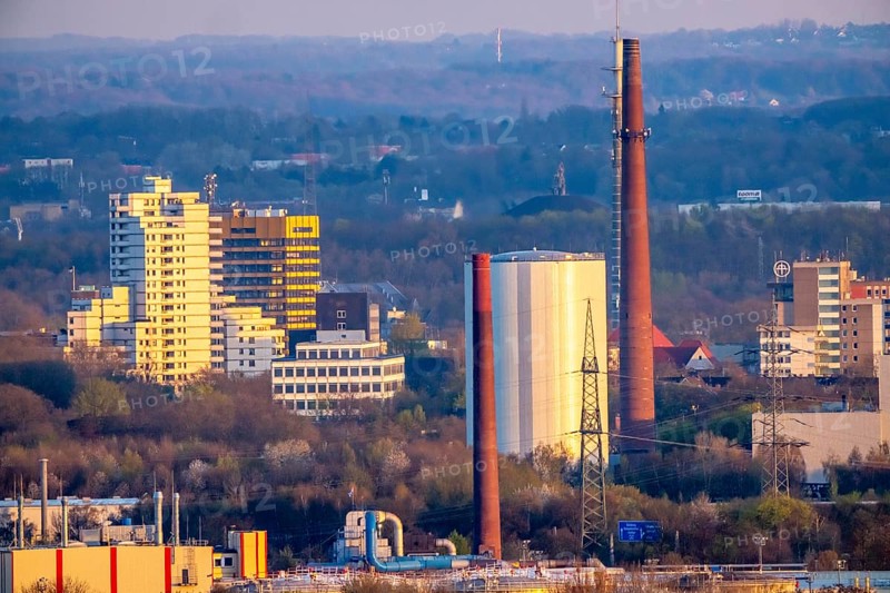 View of Gelsenkirchen, city center, high-rise residential buildings, right district heating storage from Iqony Fernwärme with a capacity of 31 million liters of water, heat capacity of 1, 050 MWh, North Rhine-Westphalia, Germany