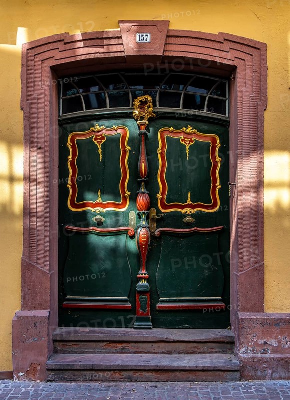 Decorative entrance door on a block of flats, Miltenberg, Bavaria, Germany