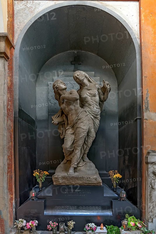 Sculptures on a grave in a niche in the Monumental Cemetery, Cimitero monumentale di Staglieno), Genoa, Italy