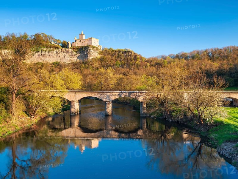 The ruins of Rudelsburg Castle and the bridge over the Saale in spring, Saale Valley near Bad Kösen, Naumburg, Saxony-Anhalt, Germany