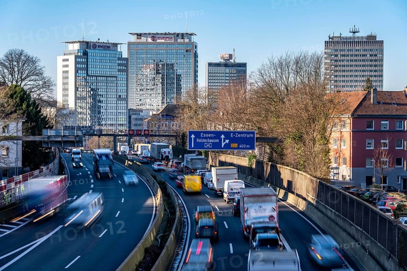 The A40 motorway, Ruhrschnellweg, in Essen, city skyline, Evonik office building, traffic jam in the westbound lane, Duisburg, slow traffic, North Rhine-Westphalia, Germany