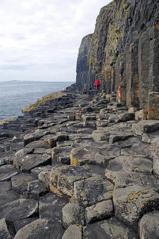 Rugged coastline with basalt columns and rocky surface by the sea, Staffa, Hebrides, Scotland, Great Britain