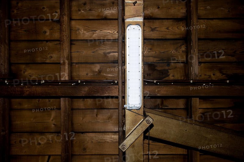 LED lamp on a steel girder in an industrial plant