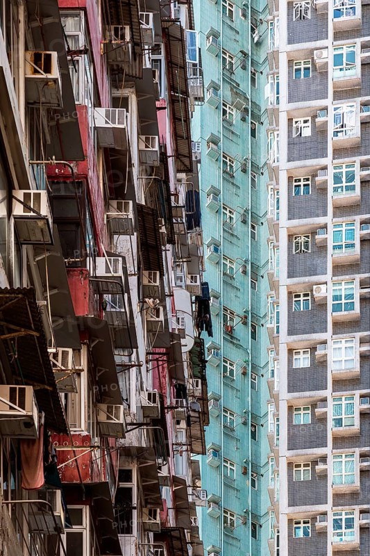 An intricate view of densely packed high-rise residential buildings in Hong Kong, highlighting urban architecture and the challenges of overpopulation in the city