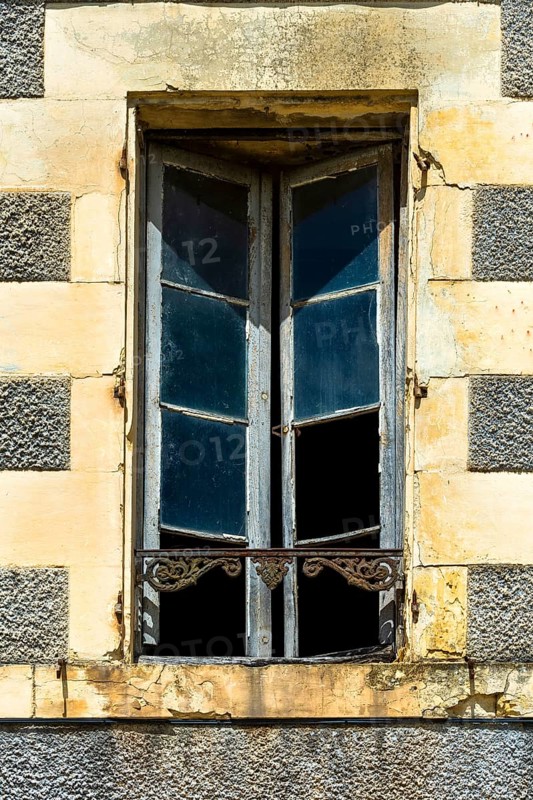 Open window in an abandoned building. Nevers. Nievre departement. France