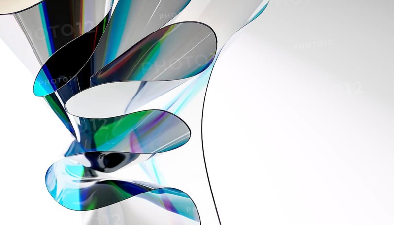 Dynamic abstract composition featuring colorful swirling 3D glass shapes with light reflections, creating a vivid display of movement and color contrast on a white background