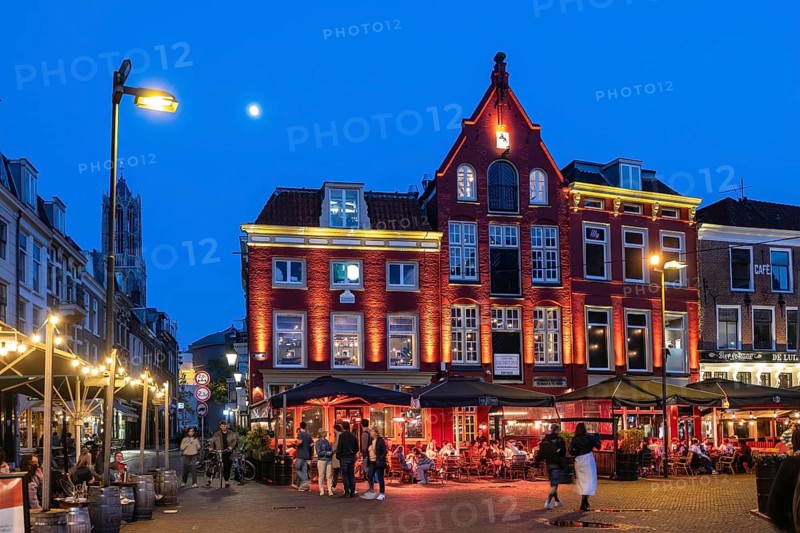 Nightlife at De Neude square in the background the bell tower of the cathedral in the historic centre of Utrecht, Netherlands