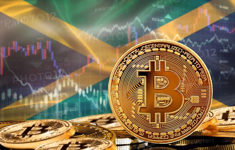 Investors in cryptocurrency and Blockchain Technology in Jamaica, Concept. Bitcoin with Jamaican flag in the background