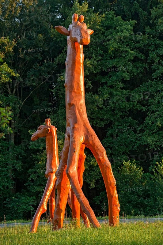 Giraffes made of red painted tree trunks, wooden sculpture by Günter Schumann, Museum of the Imagination by Lothar-Günther Buchheim, Bernried am Starnberger See, Upper Bavaria, Bavaria, Germany