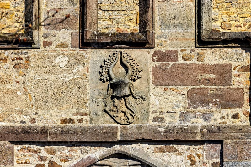Heraldic coat of arms in stone relief on an old wall, The Tor tor of Spangenberg Castle