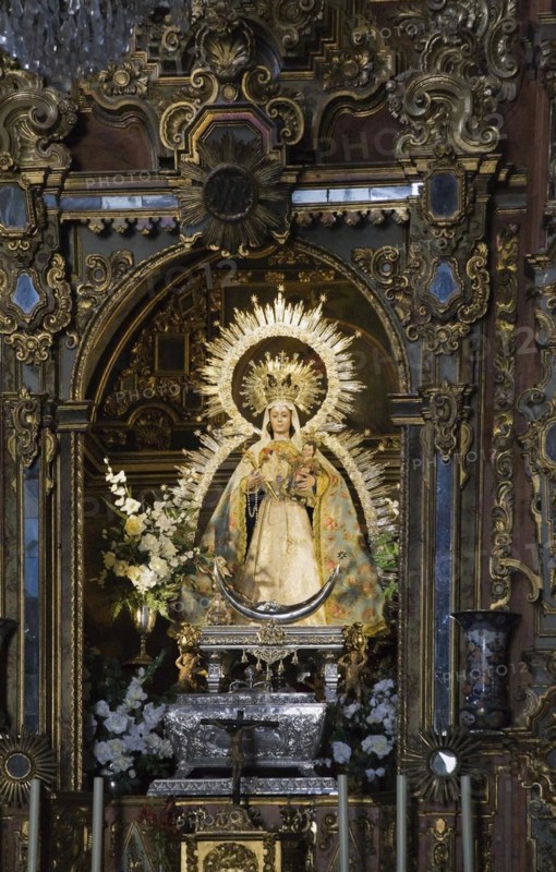 Religious female statue inside an elegantly decorated church in Ronda, Spain