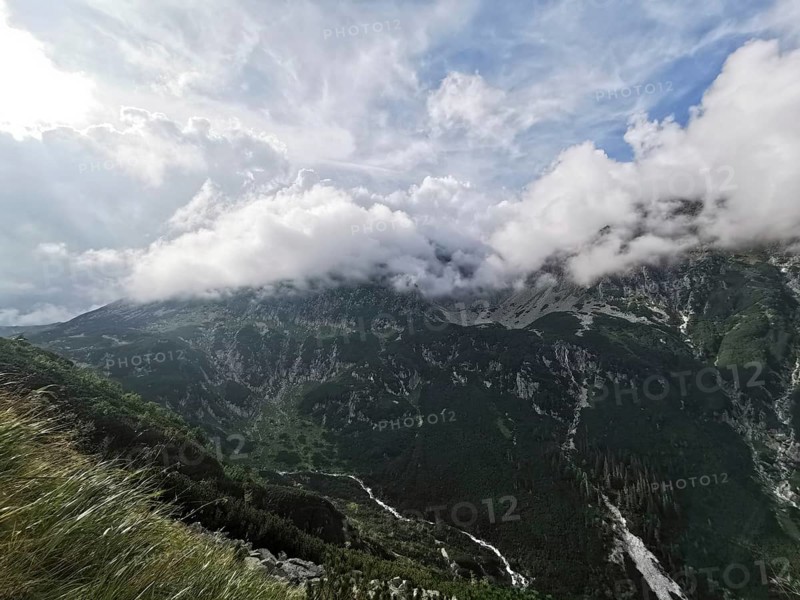 Breathtaking mountain panorama under a dynamic sky, Zakopane, hiking in the High Tatras National Park, Carpathian Mountains, Poland