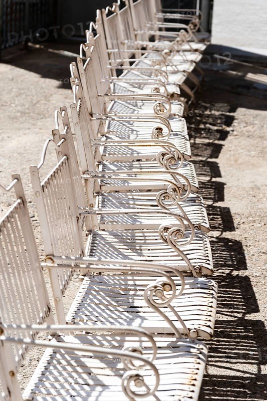Row of white steel chairs in Barcelona, Spain