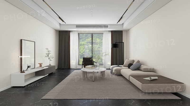 A spacious, modern living room featuring a sleek sectional sofa, elegant coffee table, and abundant natural light streaming through large windows, creating a serene atmosphere