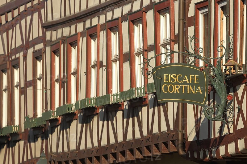 Nose sign of half-timbered house Eiscafe Cortina, inscription, ice cream parlour, window row, Miltenberg, Bavaria, Germany