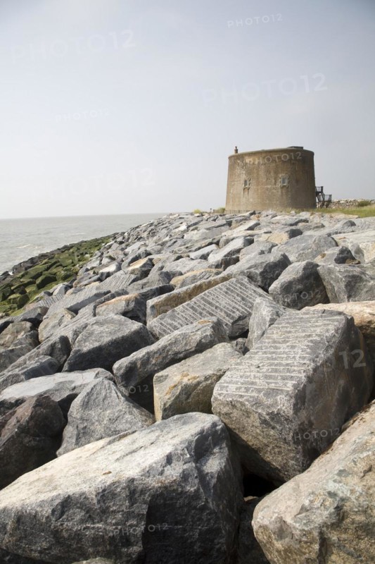 Coastal erosion and management, East Lane, Bawdsey, Suffolk, England. The new rock armour defences and massive engineering work undertaken in 2009 have been paid for through an Innovative scheme under which local farmers have donated land to be sold land for housing to pay for coastal defences. Bawdsey, Suffolk, England
