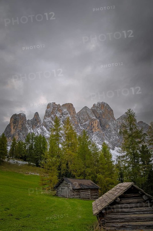 View of a part of the Geisler group in the foreground two mountain huts, Dolomites, snow, Puez-Geisler nature park Park, St. Magdalena, Villnöß, Funes, Villnößtal, South Tyrol, Italy