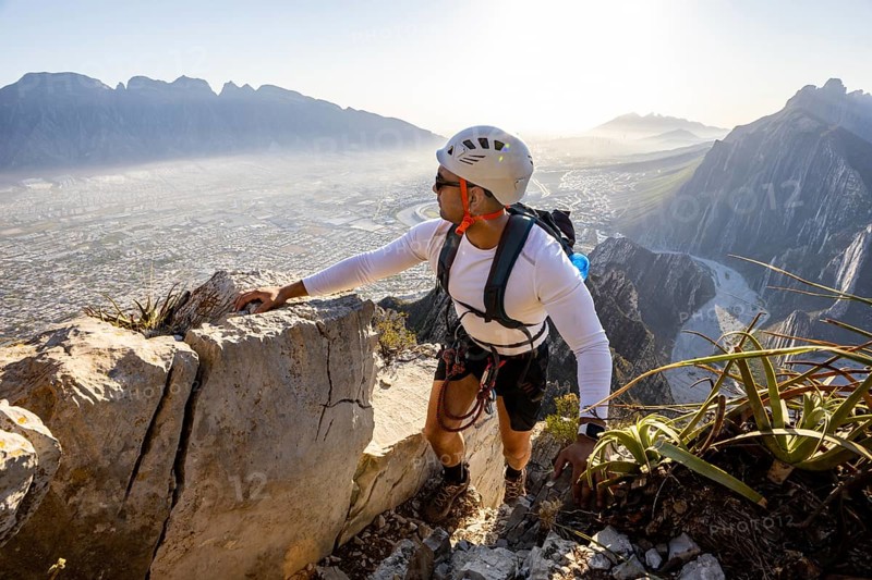 A man expertly practices mountaineering and rappelling at Eagleâ€™s Nest in Monterrey, Mexico. Surrounded by stunning rocky landscapes, he showcases skill and adventure