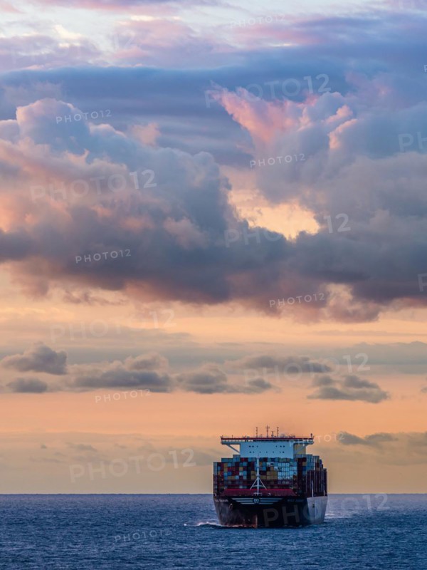 Maersk Line Container Ship on sea at sunrise, Barcelona, Spain