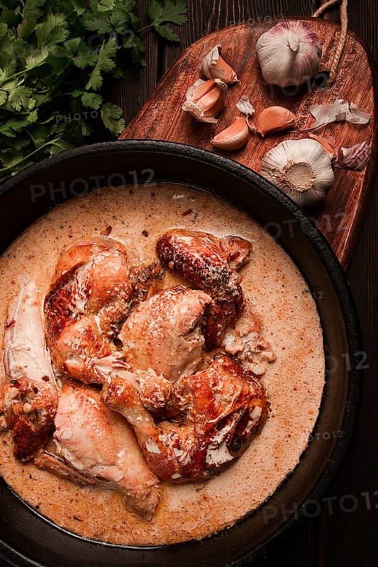 Shkmeruli, fried chicken, in milk-garlic sauce, Georgian cuisine, homemade, close-up, no people