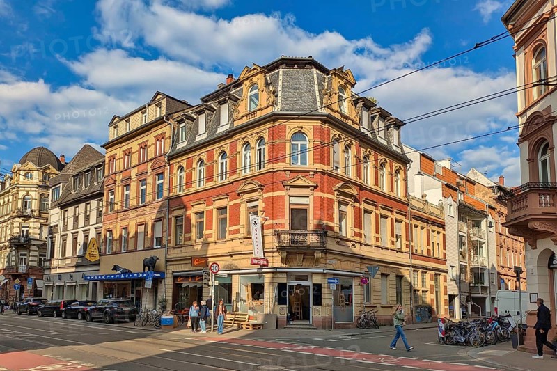 Heidelberg, Germany - 19 March 2026: Historic corner building at Brückenstraße 16 in Heidelberg illuminated by warm evening sun