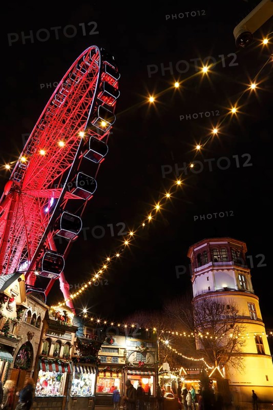 Rhine promenade with Castle Tower and illuminated Ferris wheel at dusk, Dusseldorf, North Rhine-Westphalia, Germany