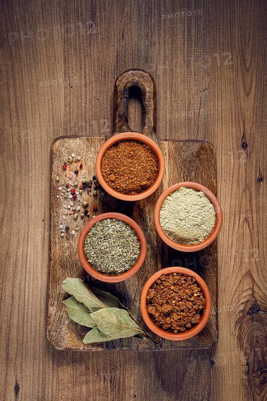 Georgian spices, in ceramic bowls, assortment, set of spices, utsho, adjika, Svan salt, ground coriander, top view, no people