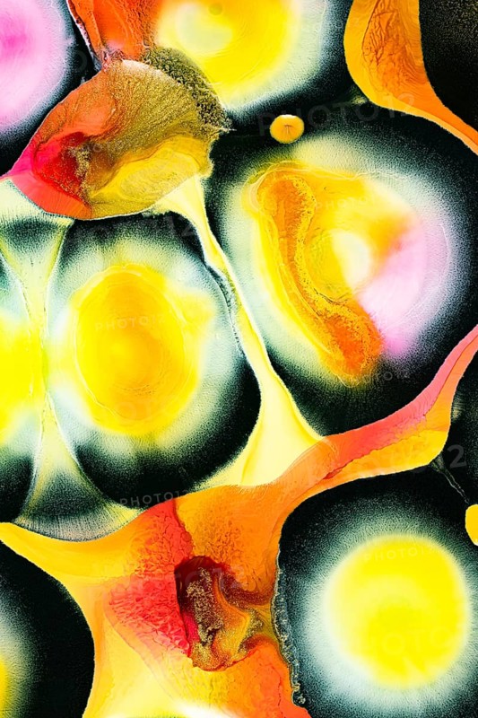 An abstract composition featuring vibrant hues of yellow, orange, and black. The textured ripples create a dynamic flow, evoking energy and movement in the artwork