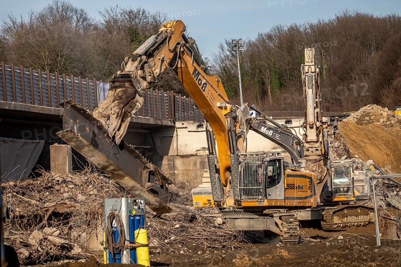 Demolition of the 120 meter long motorway bridge of the A516, across Teutoburger Straße in Oberhausen-Sterkrade, the bridge, built in 1970 was severely damaged, traffic continues to roll on the still existing West Bridge, after the demolition, the eastern part is rebuilt using a process unique in the world, 40 meter long precast concrete beams are assembled one after the other, reducing the construction period from 24 to 7 months after the completion of this bridge Will the western part also be rebuilt, North Rhine-Westphalia, Germany
