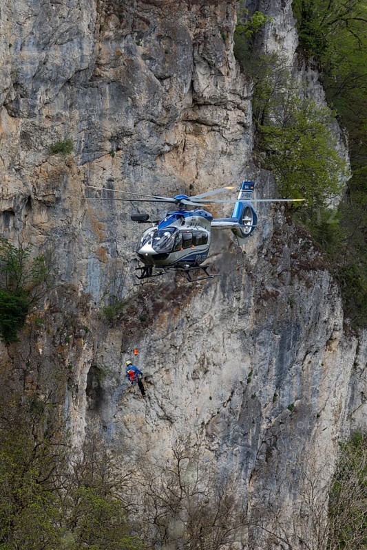 Police rescue operation. Helicopter in action at the slide rock near Bad Urach, Reutlingen district, Swabian Alb on 23/04/2025