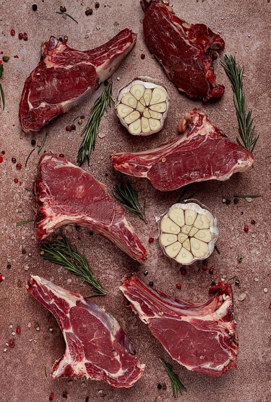 Fresh, raw calf ribs, with spices, top view, no people