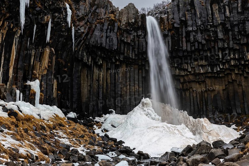 Waterfall, basalt columns, snow, winter, Svartifoss, Iceland, Scandinavia