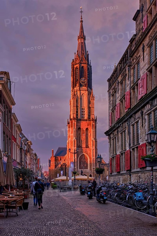 Delft, Netherlands, May 12, 2017: Nieuwe Kerk New Church protestant church on Delft Market Square Markt with dramatic sky on sunset. Delft, Netherlands