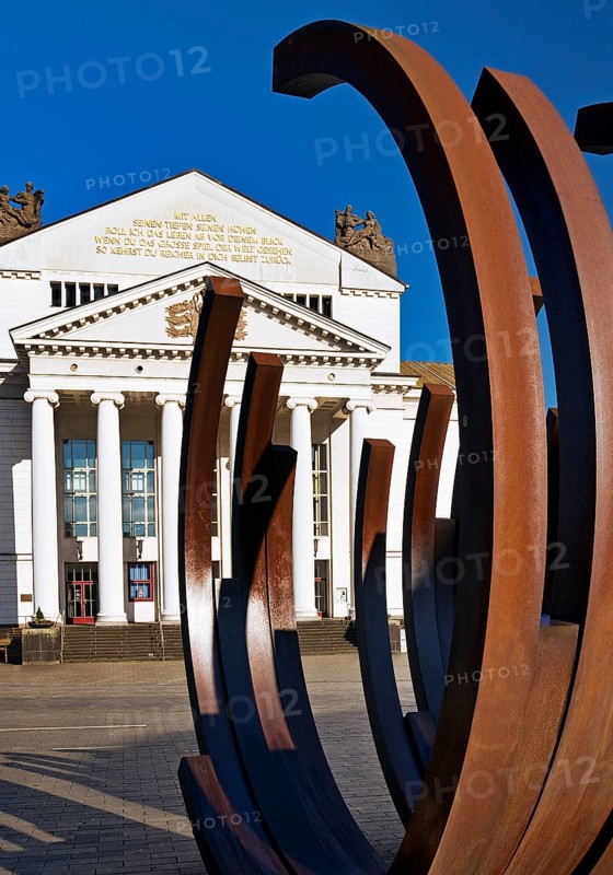 Opera Square with art sculpture 5 Arcs x 5 by Bernar Venet in front of the Deutsche Oper am Rhein, Duisburg, North Rhine-Westphalia, Germany